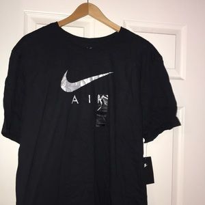 Black w/silver & grey w/black Nike t-shirts both